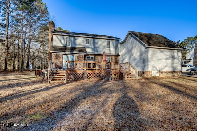 back of property with a wooden deck