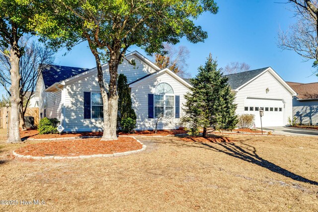 single story home with a front lawn and a garage