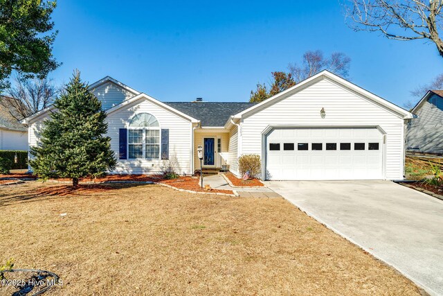 single story home featuring a garage and a front lawn