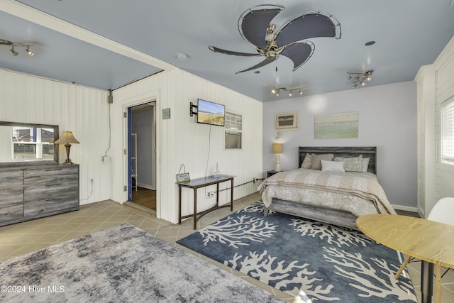 tiled bedroom featuring rail lighting