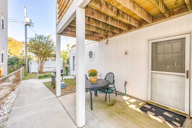 view of patio / terrace featuring a storage shed