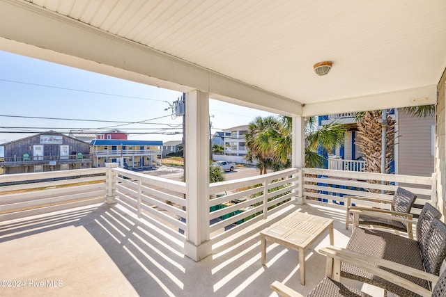 view of patio featuring a residential view and a balcony