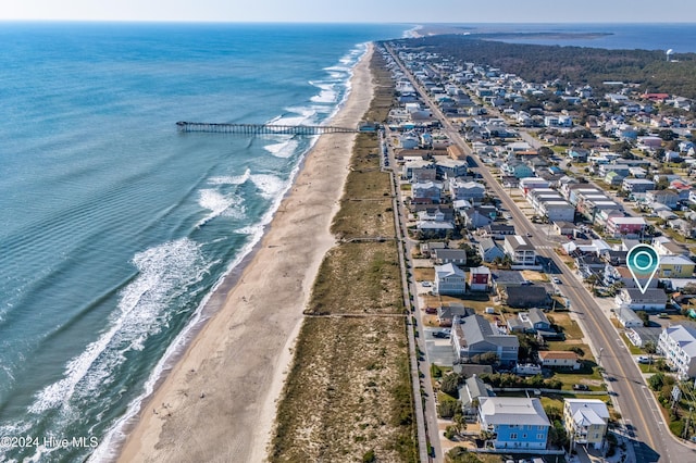 birds eye view of property with a view of the beach and a water view