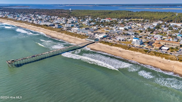 drone / aerial view featuring a water view and a view of the beach