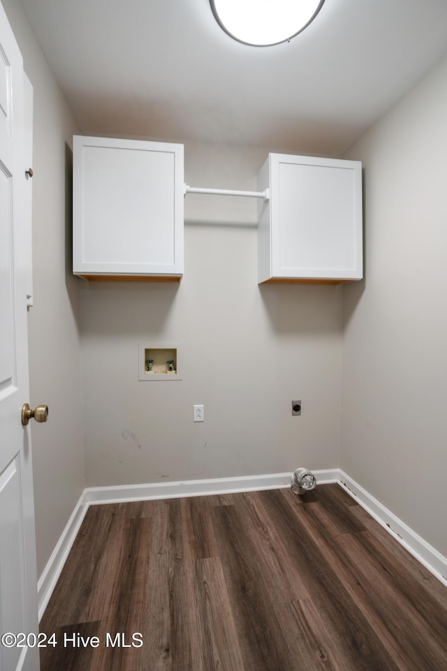 laundry room featuring cabinets, hookup for a washing machine, dark hardwood / wood-style floors, and electric dryer hookup