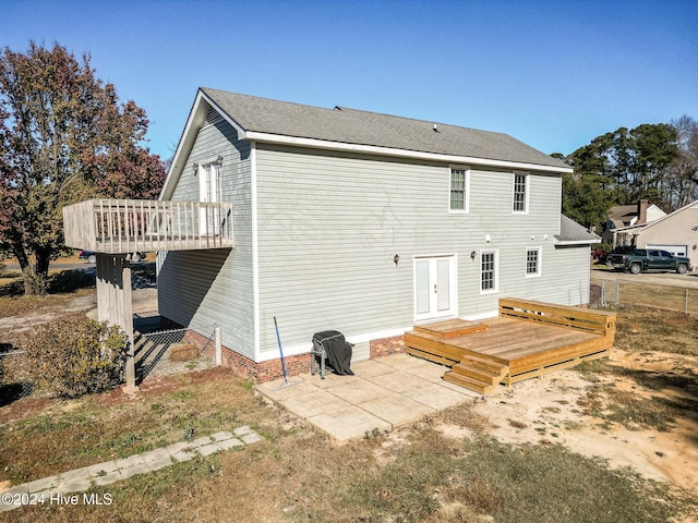 rear view of house with a patio area and a deck