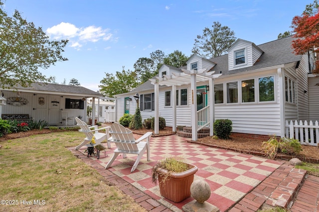 1339 Bayview Rd, Bath, NC 27808 - rear view of house featuring a pergola, entry steps, a patio area, a lawn, and a shingled roof