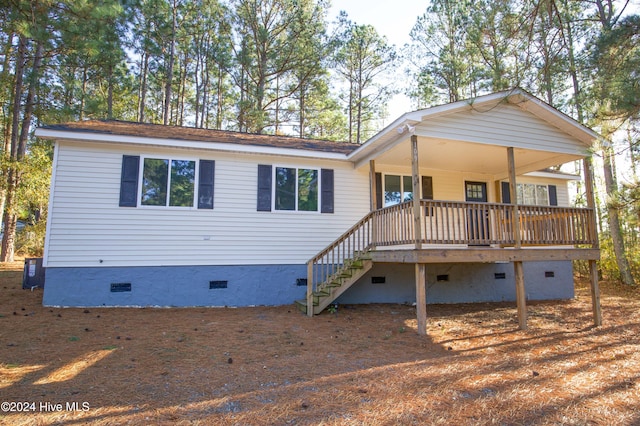 back of property featuring central AC