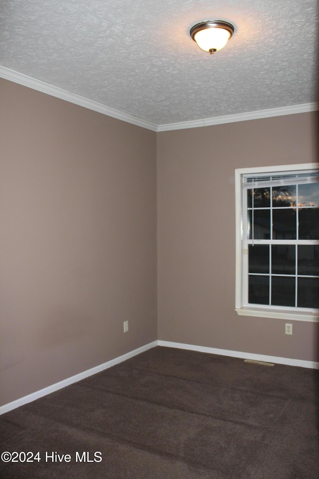 unfurnished room featuring a textured ceiling, carpet floors, and ornamental molding