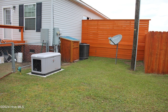 view of yard featuring central AC unit