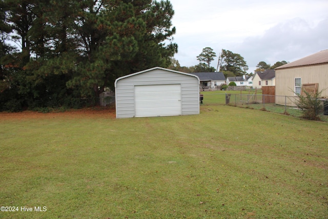 garage featuring a lawn