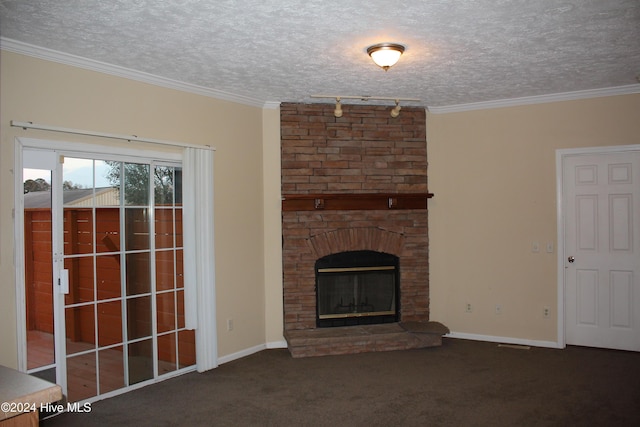 unfurnished living room featuring a fireplace, dark carpet, a textured ceiling, and ornamental molding