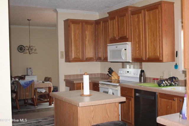 kitchen with a chandelier, pendant lighting, white appliances, and crown molding