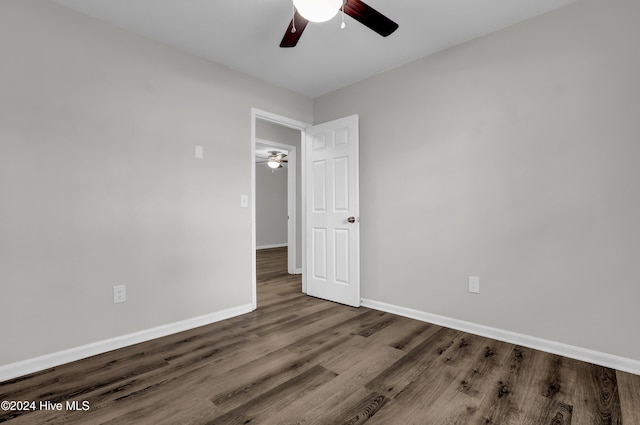 empty room featuring hardwood / wood-style flooring and ceiling fan