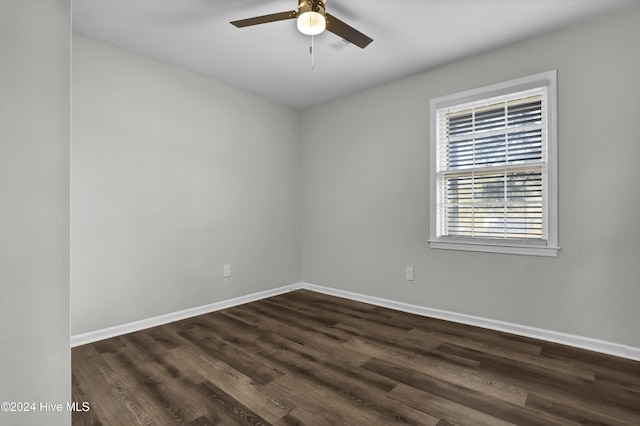 spare room featuring ceiling fan and dark hardwood / wood-style flooring