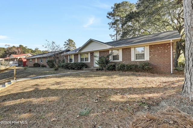 ranch-style house with a front lawn