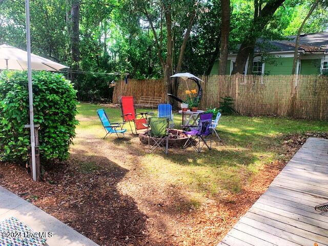 view of yard with an outdoor fire pit