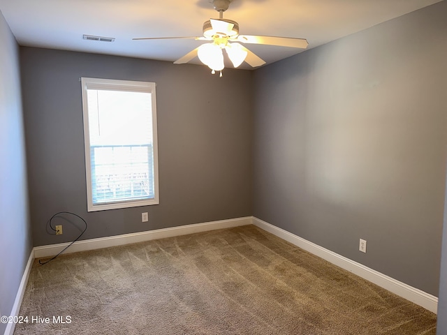 carpeted empty room with ceiling fan