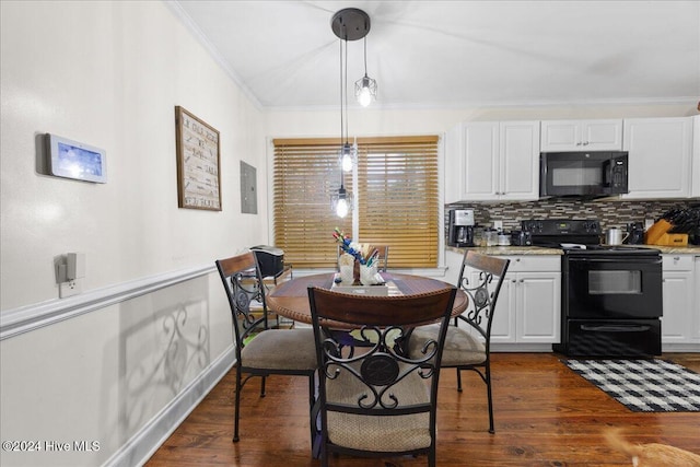 dining room with electric panel, dark wood-type flooring, and ornamental molding