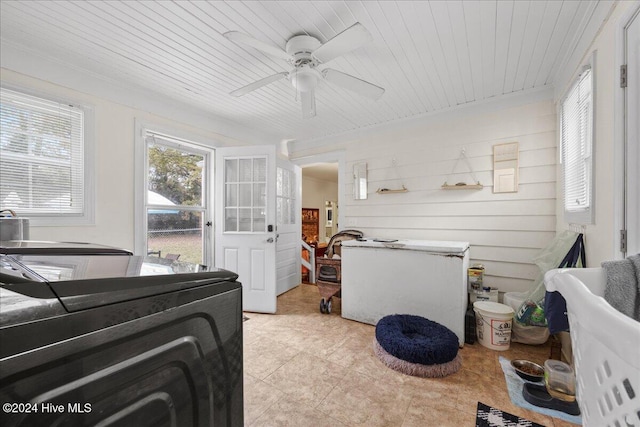 interior space featuring ceiling fan and wood ceiling