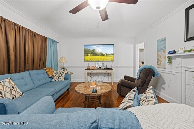 living room with dark hardwood / wood-style floors, ceiling fan, and crown molding