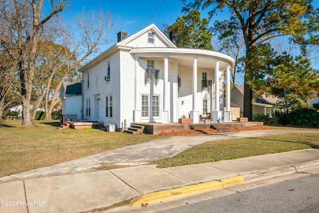 neoclassical / greek revival house with a front yard