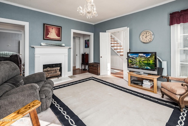 living room with a notable chandelier and ornamental molding