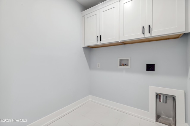 laundry room featuring tile patterned flooring, hookup for an electric dryer, washer hookup, baseboards, and cabinet space