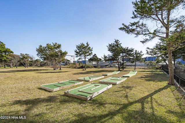 view of property's community featuring a yard