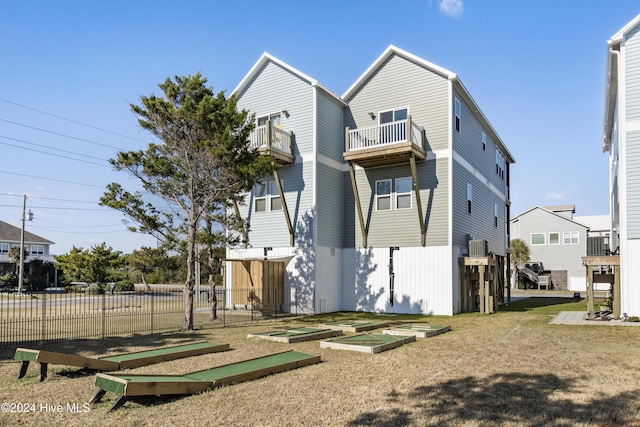 back of property featuring a balcony