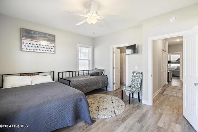 bedroom featuring ceiling fan and light hardwood / wood-style flooring