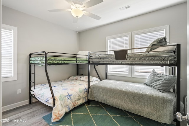 bedroom featuring wood-type flooring and ceiling fan