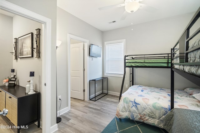 bedroom featuring ceiling fan and light hardwood / wood-style floors