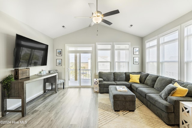 living room featuring light hardwood / wood-style flooring, ceiling fan, and lofted ceiling