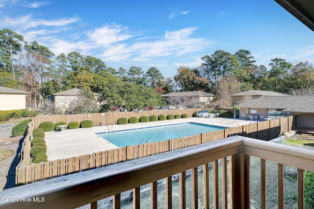 view of swimming pool featuring a patio area