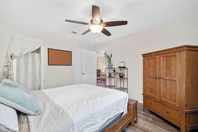 bedroom featuring ceiling fan and light hardwood / wood-style floors