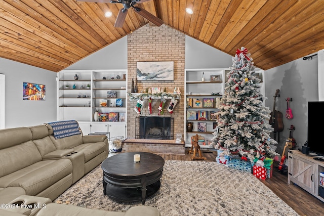 living room with lofted ceiling with beams, ceiling fan, built in features, wood-type flooring, and wood ceiling