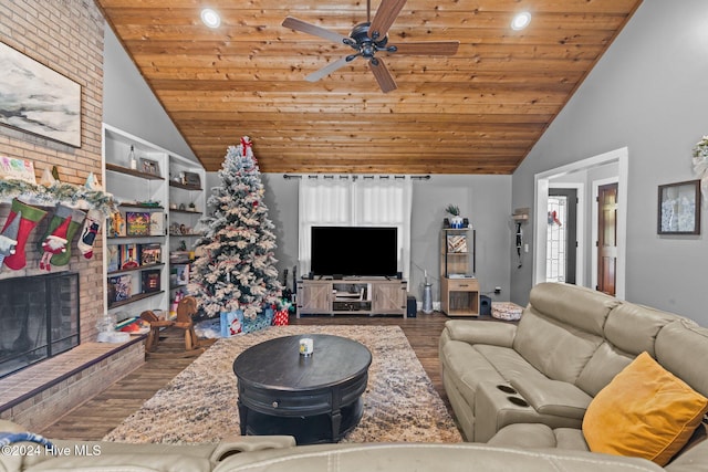 living room featuring a fireplace, built in shelves, hardwood / wood-style flooring, and wood ceiling