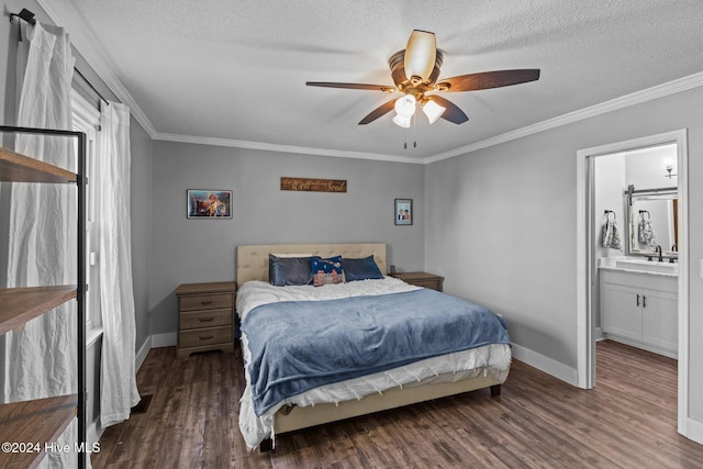 bedroom with connected bathroom, ceiling fan, dark hardwood / wood-style floors, crown molding, and a textured ceiling