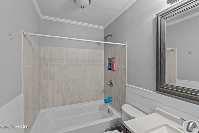 full bathroom featuring vanity, toilet, tiled shower / bath, and ornamental molding