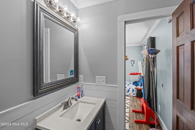 bathroom with crown molding and vanity