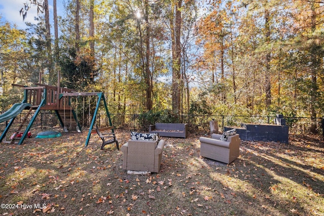 view of yard featuring a playground and an outdoor living space