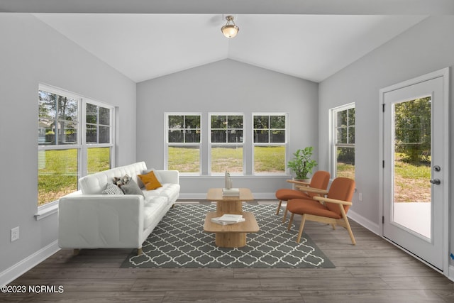 sunroom with plenty of natural light and vaulted ceiling