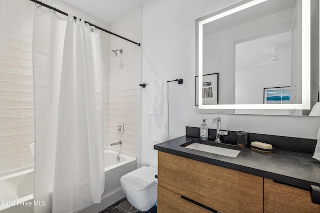 full bathroom with tile patterned flooring, shower / tub combo, vanity, and toilet