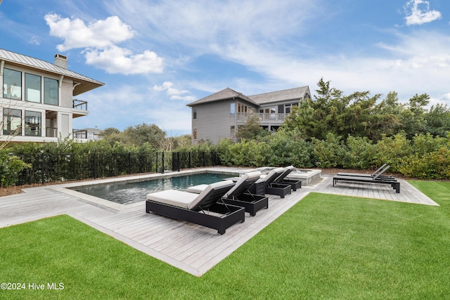 view of swimming pool featuring a patio and a lawn