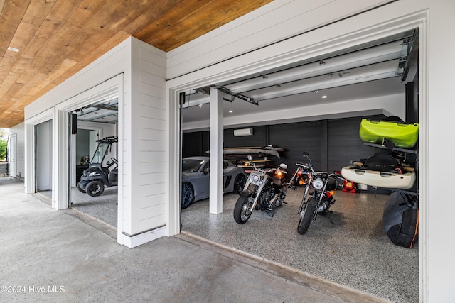 garage with wooden ceiling and wood walls