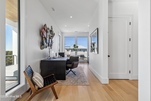 office space with light wood-type flooring