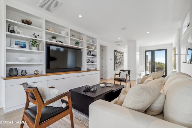 living room with light hardwood / wood-style flooring