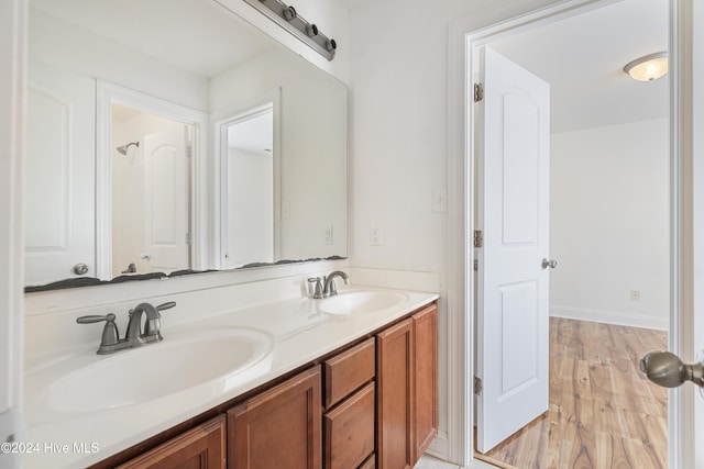 bathroom featuring hardwood / wood-style floors and vanity