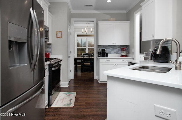 kitchen featuring white cabinets, sink, a notable chandelier, dark hardwood / wood-style flooring, and stainless steel appliances